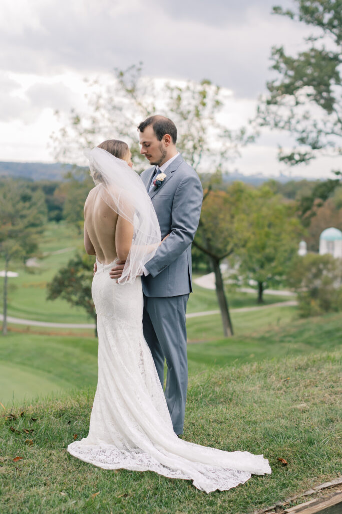 A bride and groom embrace during couple portraits in Beaufort North Carolina