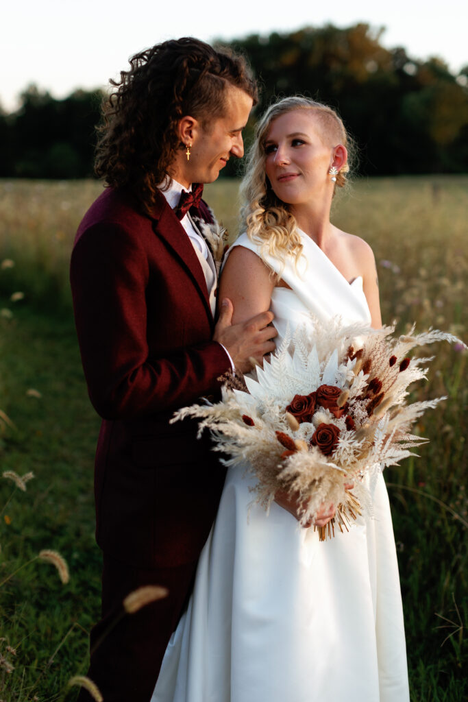 Golden hour portraits after a wedding with a bride and groom