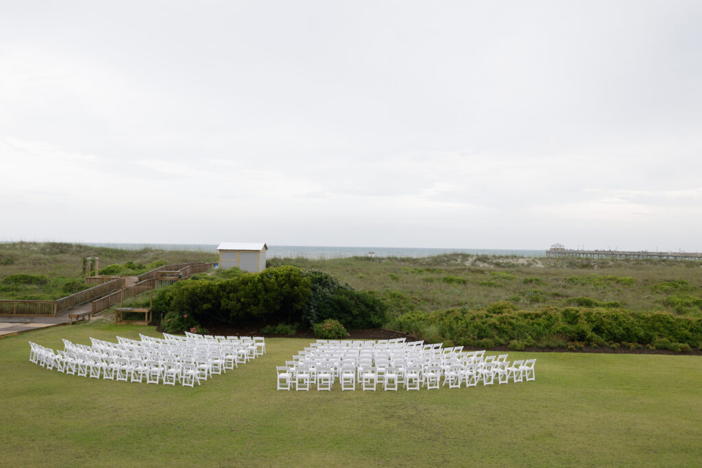 A wedding ceremony sits outside the Dunes Club in Atlantic Beach overlooking the ocean