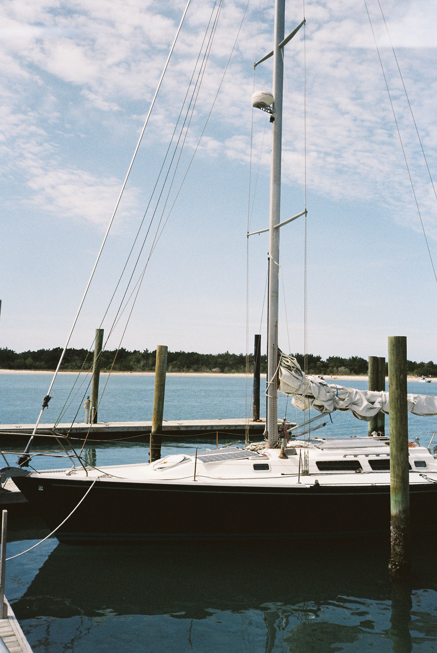 A sailboat in the harbor in Beaufort, North Carolina photographed by Hailey Rae Photography