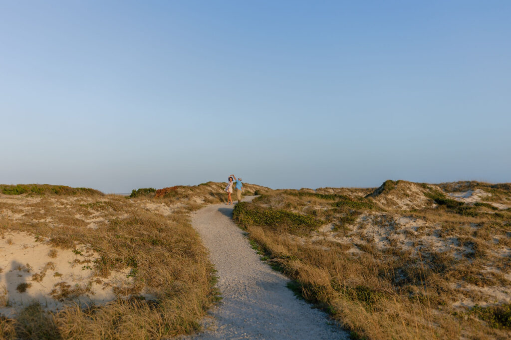 A couple dancing along the sand dunes at Fort Macon State Park 