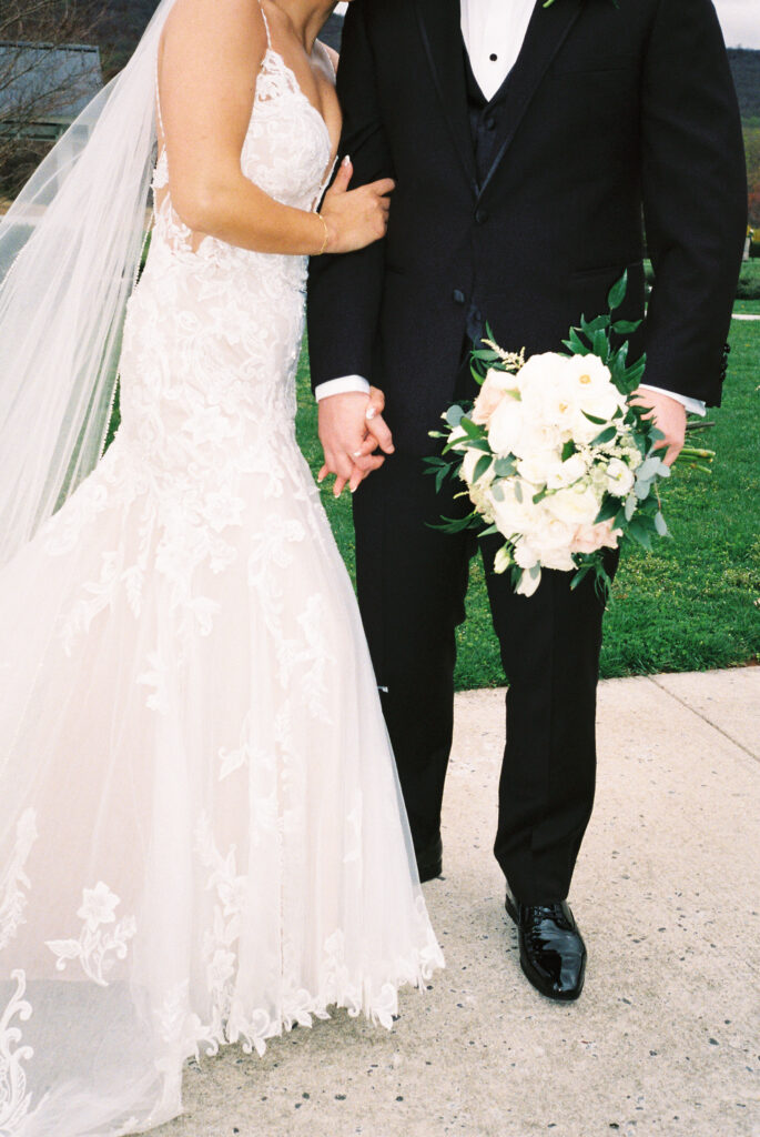 Film photography of a bride and groom holding hands at their Carolina Home and Garden Wedding
