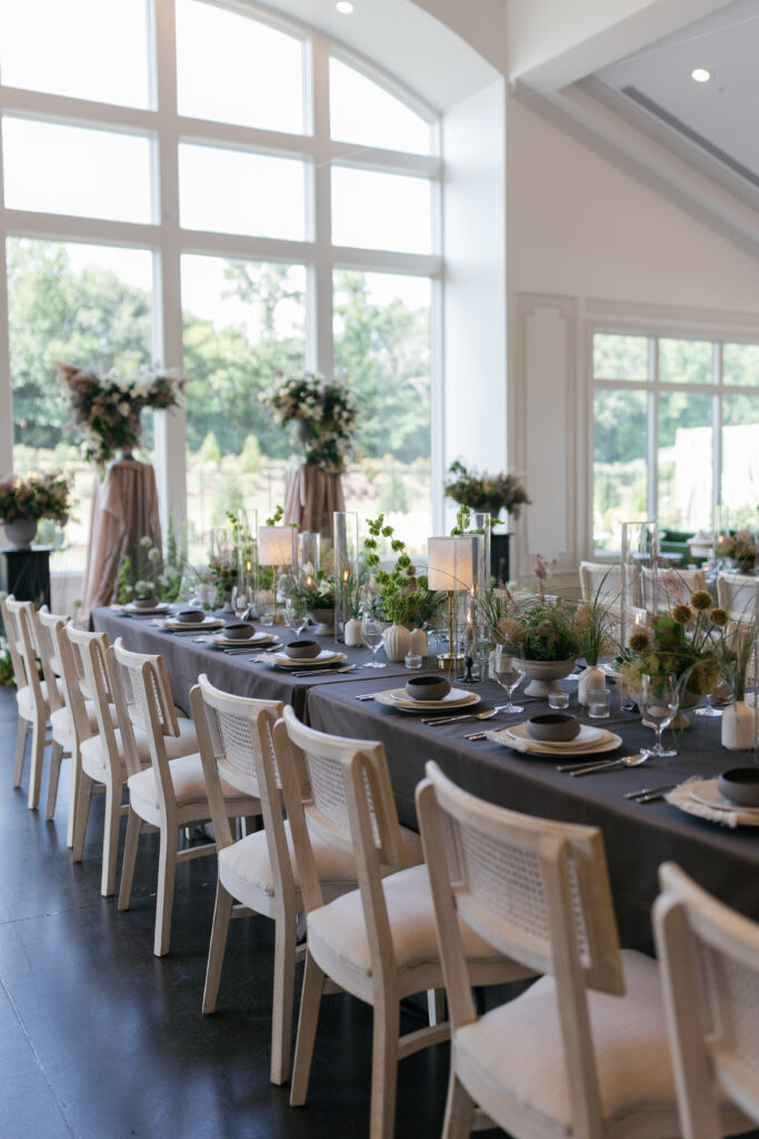 Donovan Manor indoor reception setup with long tables, brown linens, and soft lighting