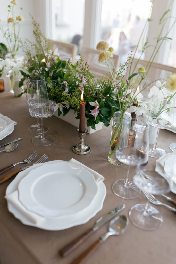 Elegant wedding reception table styling with neutral linens and natural centerpieces