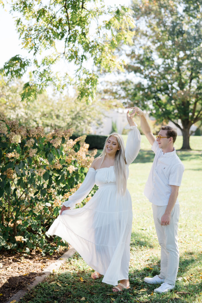 Couple dancing in open field surrounded by trees at Baker Park