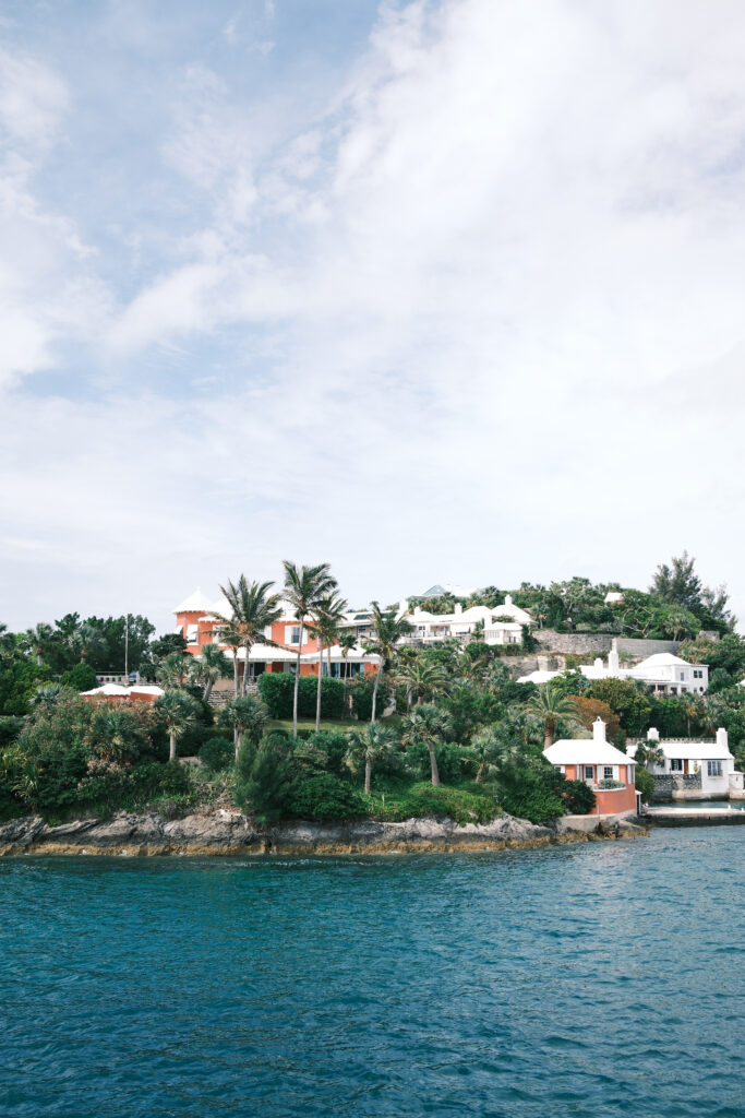 A sunny seaside scene of houses overlooking horseshoe bay in Bermuda