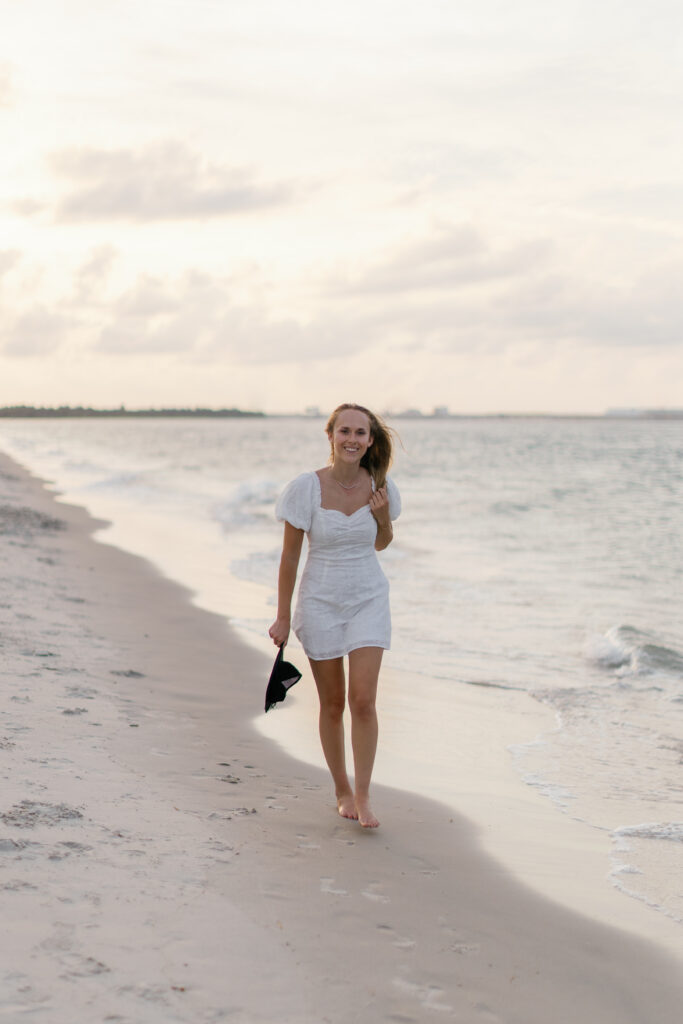MSW graduation portrait along the shoreline during an Atlantic Beach NC senior photography session