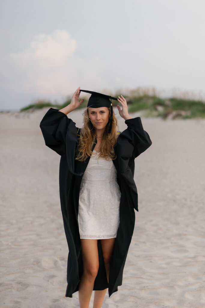 MSW graduate wearing her cap and gown during her North Carolina senior portrait session